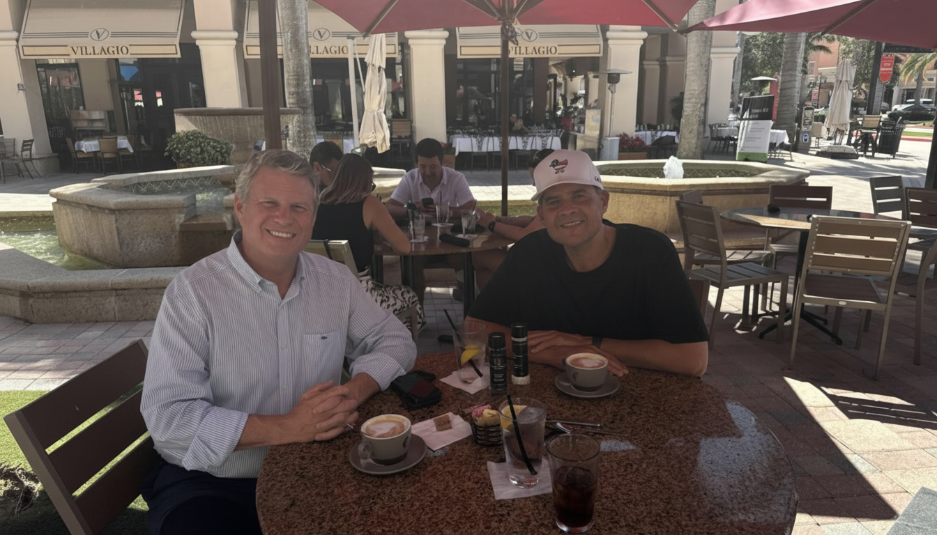 Sitting across from Congressman Bill Huizenga at an outdoor café